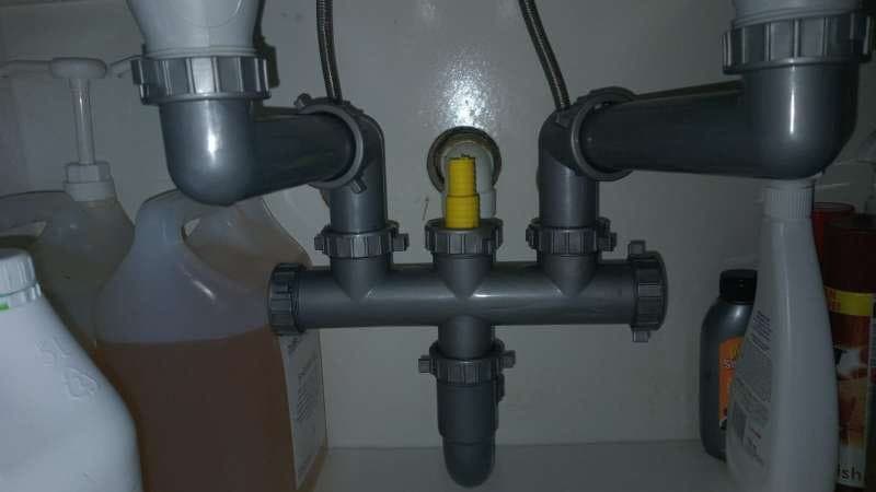 New PVC waste pipes under a double kitchen sink