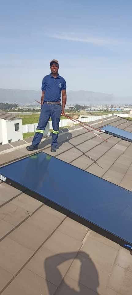 Solar geyser collector panels on a tiled Cape Town roof